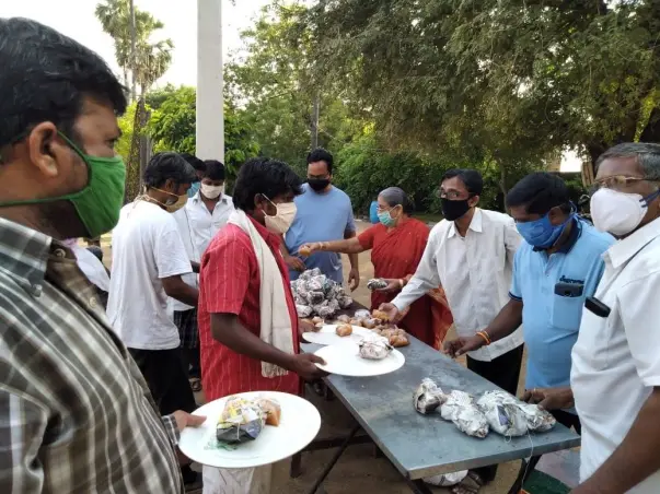 Help distribute food packets to the needy