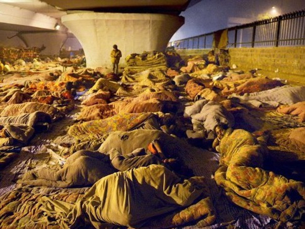 Helping Poor With Warm Blankets And Sweaters