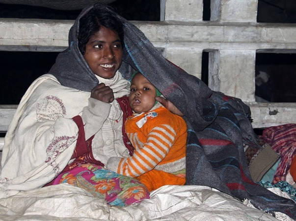 Helping Poor With Warm Blankets And Sweaters