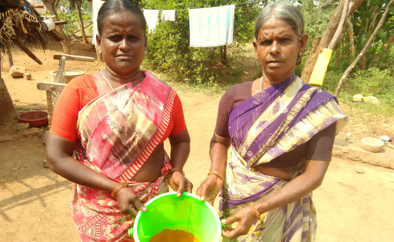 Manonmani and Pappu with the chilli powder they manufactured