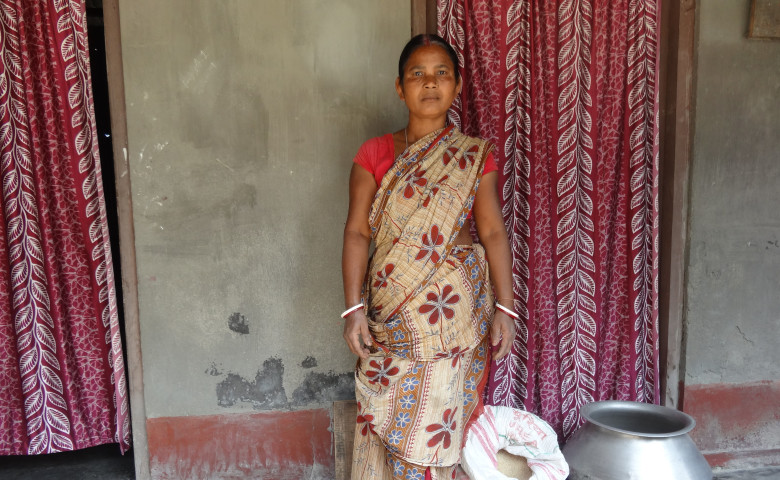 Menaka outside her home