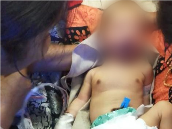 Please help the baby fighting with a hole in the heart